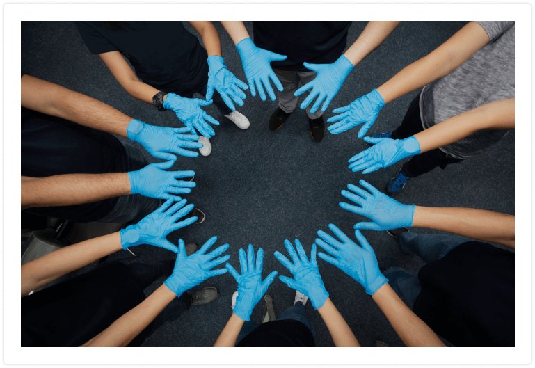 blue gloved hands making a circle 